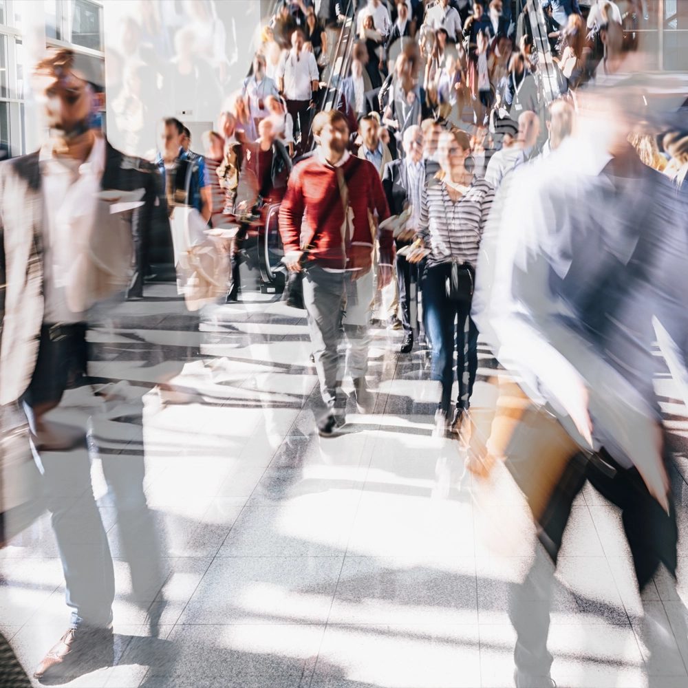 Busy crowd of professionals in motion